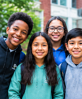 A diverse group of students together outside a school